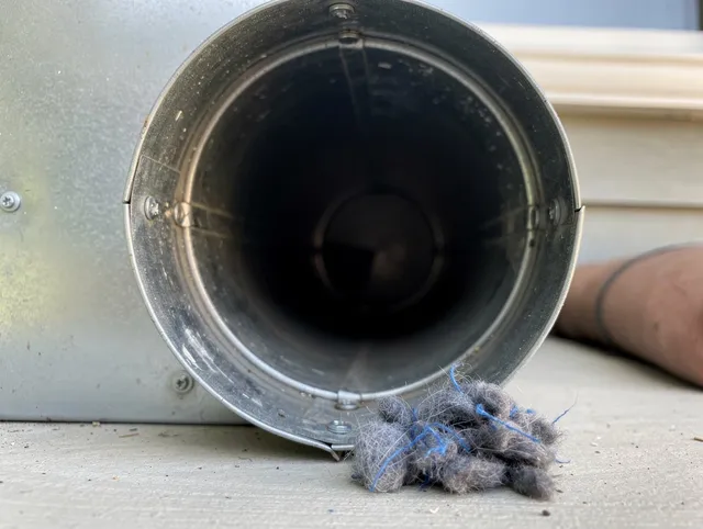 Loma Linda Dryer Vent Cleaning technician using specialized equipment to clear severe dryer vent blockage in Loma Linda